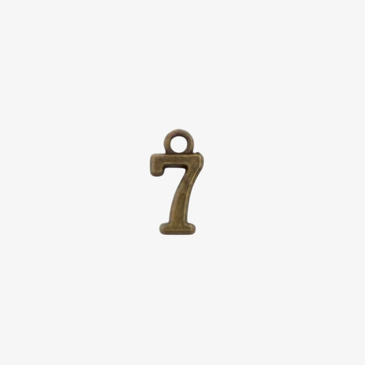 Bronze-colored number '7' charm on a white background