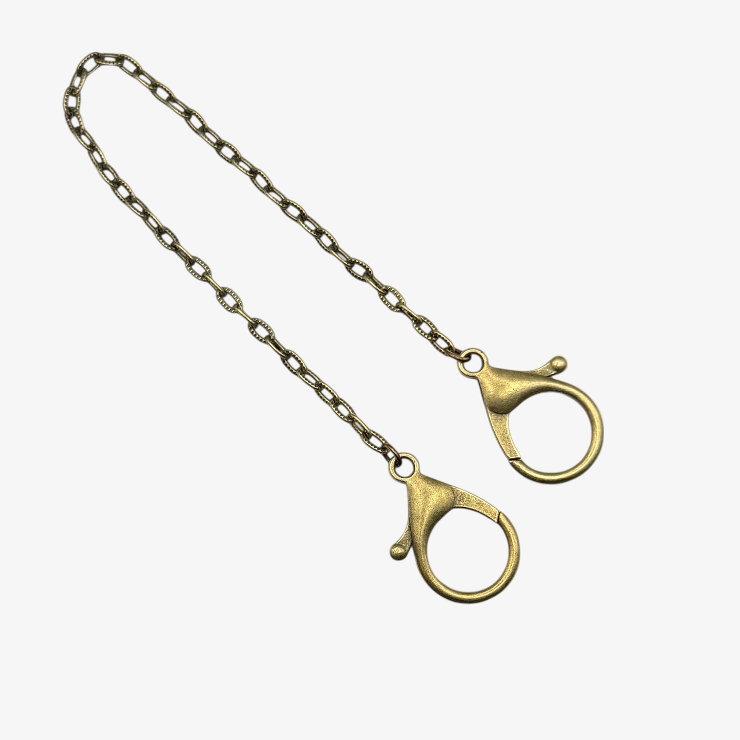 Gold chain with clasp on a white background