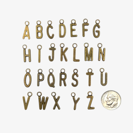 Bronze-colored letter charms from A to Z