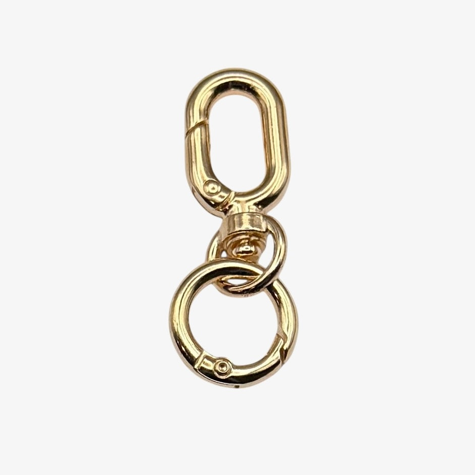 Gold metal clip on a white background