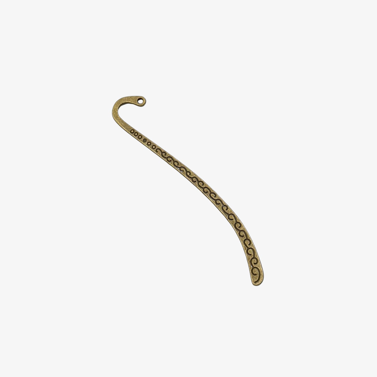 Decorative metal bookmark with a curved design on a white background