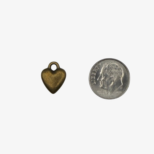 Bronze heart-shaped charm on a white background