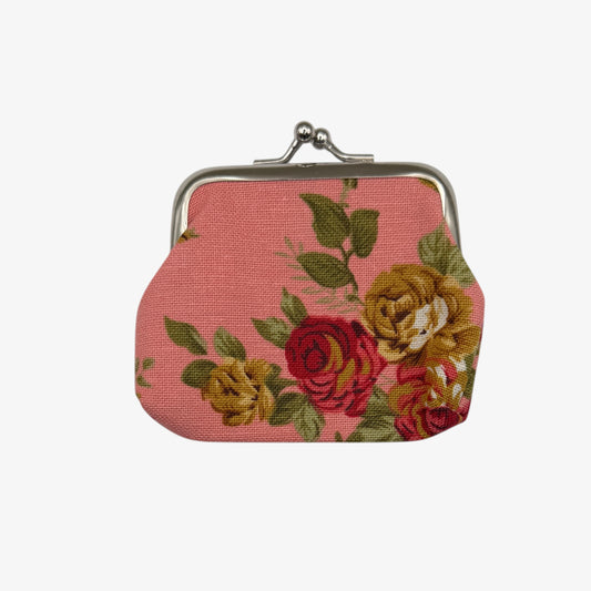Floral-patterned coin purse on a white background