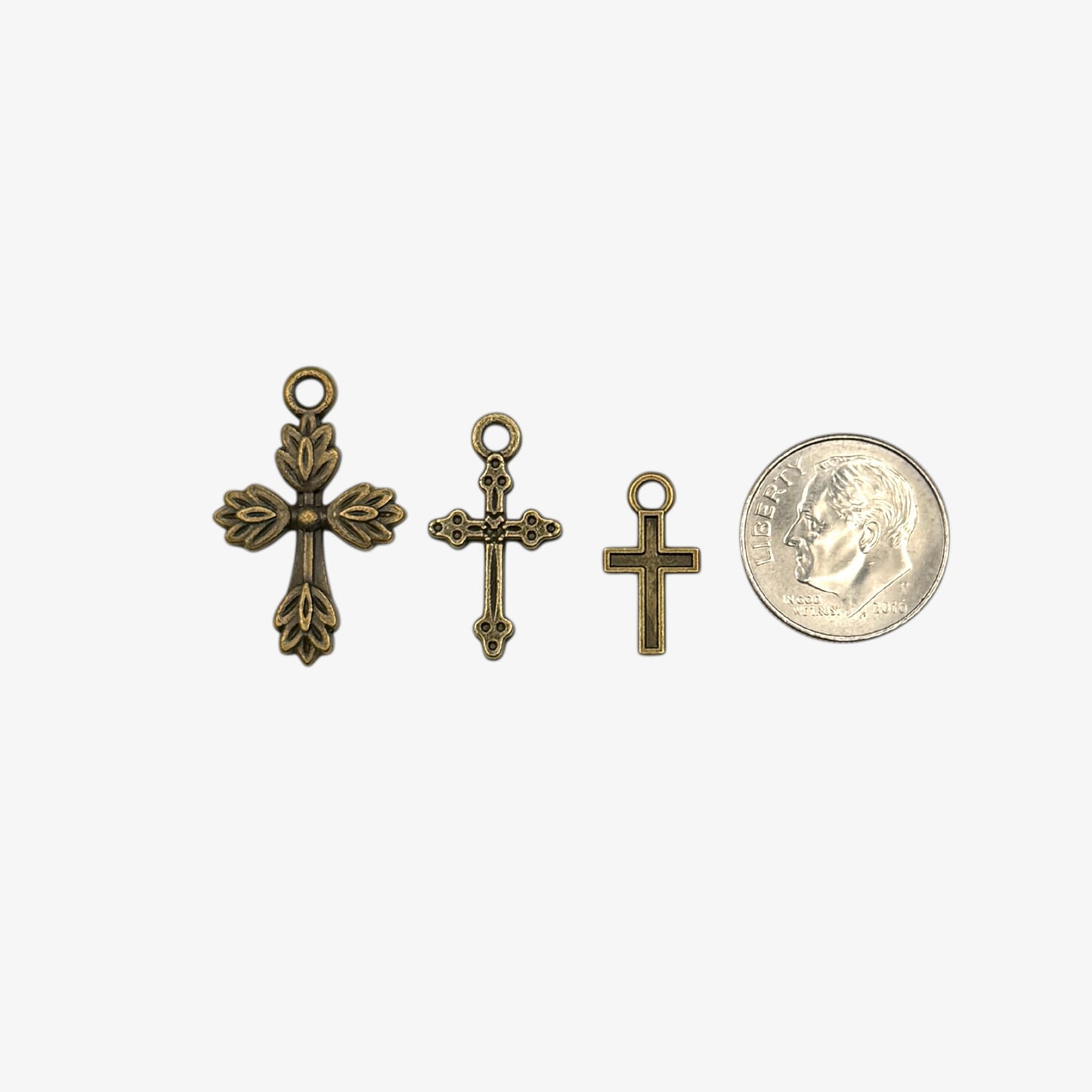 Three small bronze cross pendants