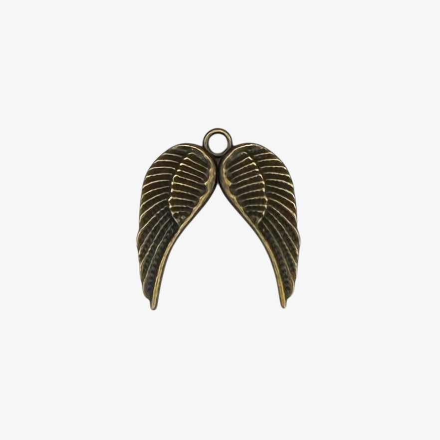 Bronze-colored angel wing pendant on a white background