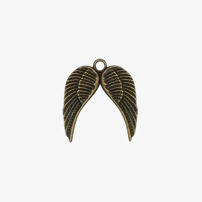 Bronze-colored angel wing pendant on a white background