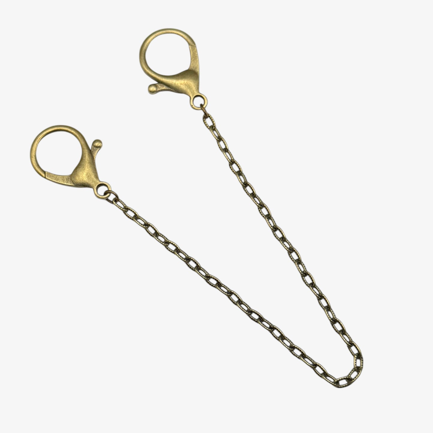 Gold chain with clasp on a white background