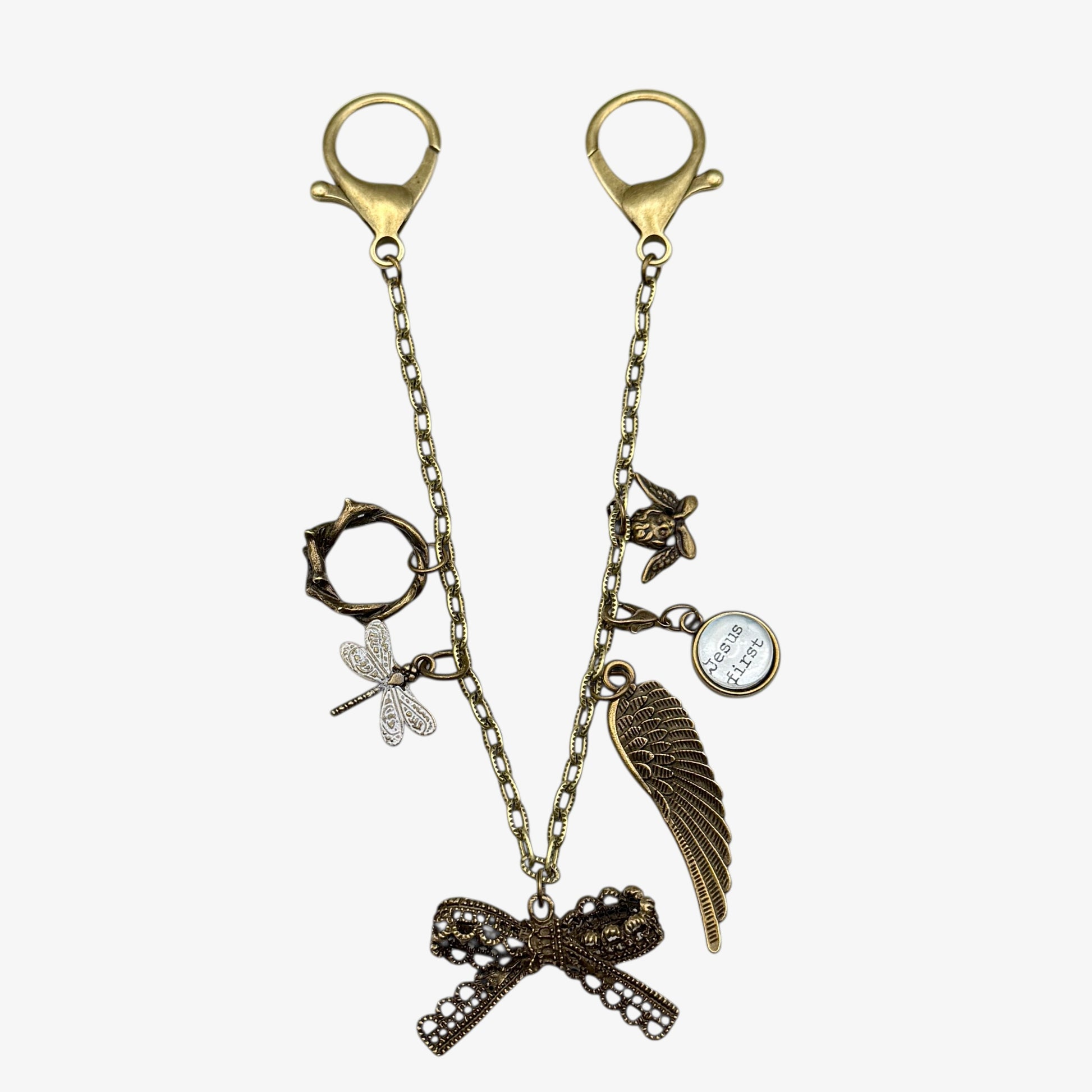 Decorative keychain with various charms on a white background
