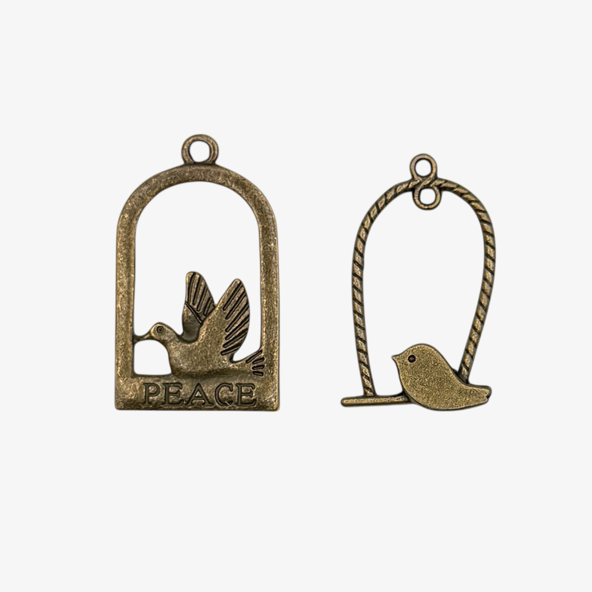 Bronze charms with birds on a perch