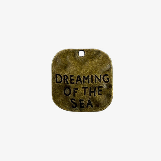 Bronze pendant with 'Dreaming of the Sea' engraving 