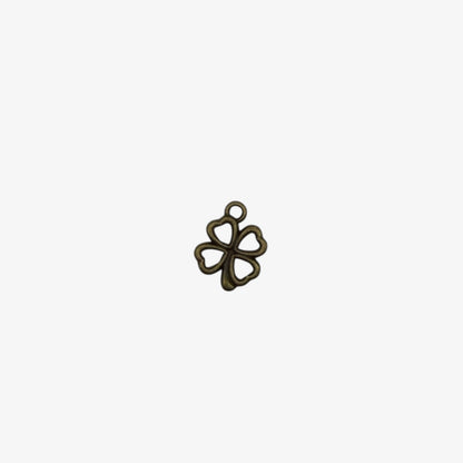 Bronze-colored four-leaf clover pendant on a white background