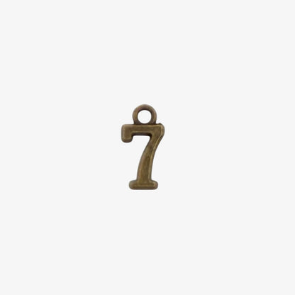 Bronze-colored number '7' charm on a white background