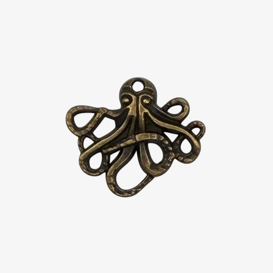 Bronze-colored octopus pendant on a white background