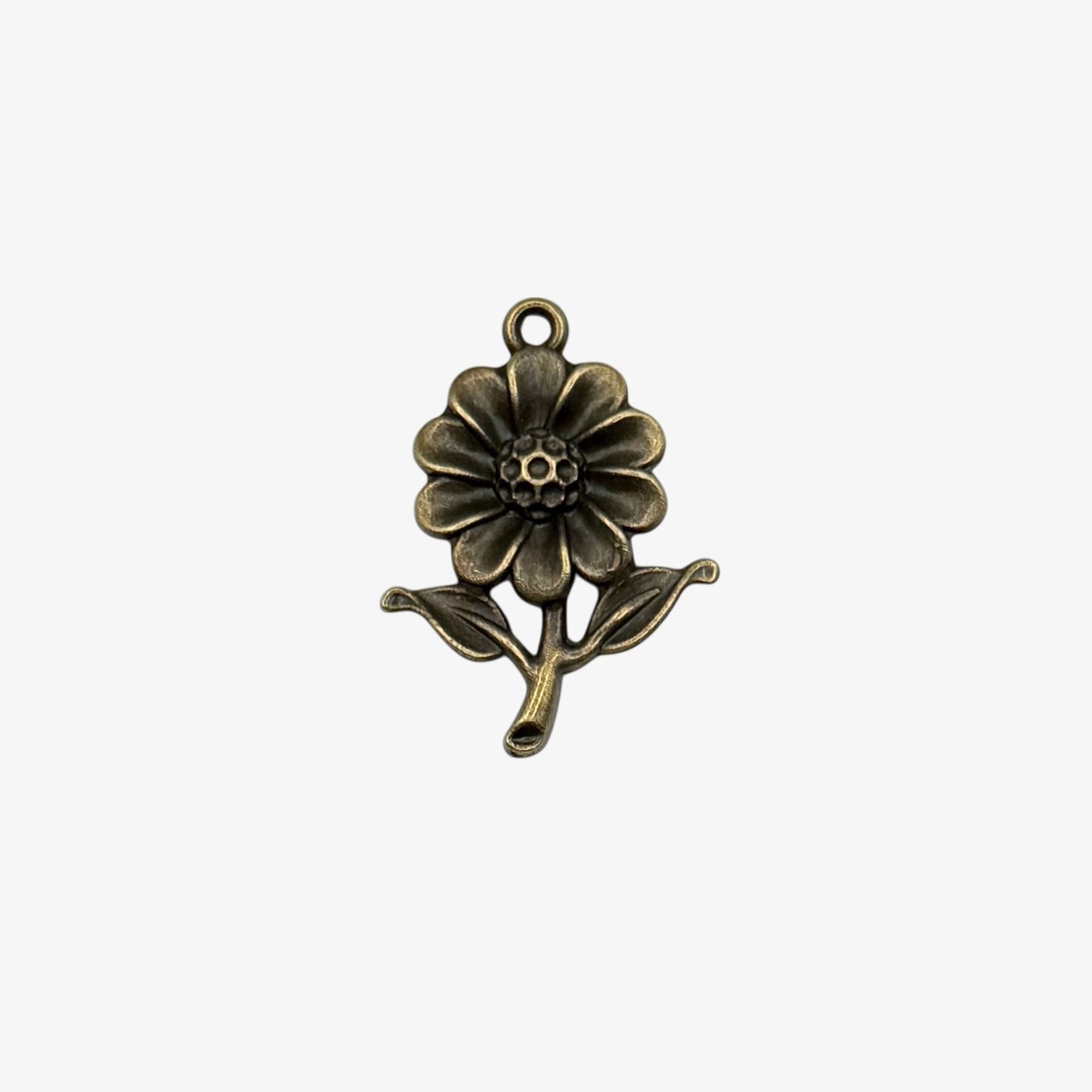 Bronze flower-shaped pendant on a white background