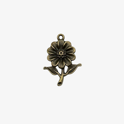 Bronze flower-shaped pendant on a white background