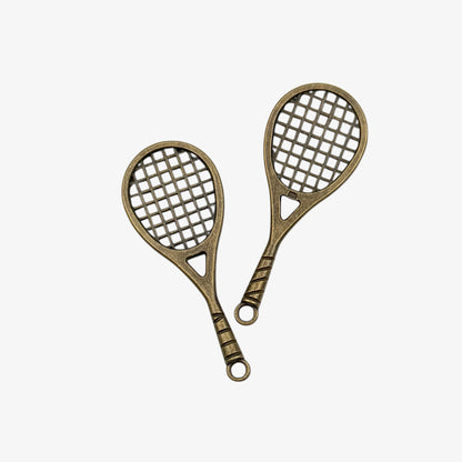 Two bronze-colored racquet-shaped keychains on a white background