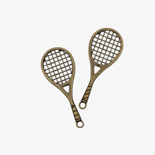 Two bronze-colored racquet-shaped keychains on a white background