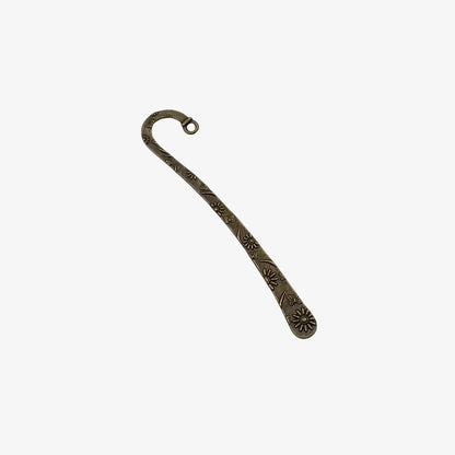 Decorative metal hook bookmark on a white background