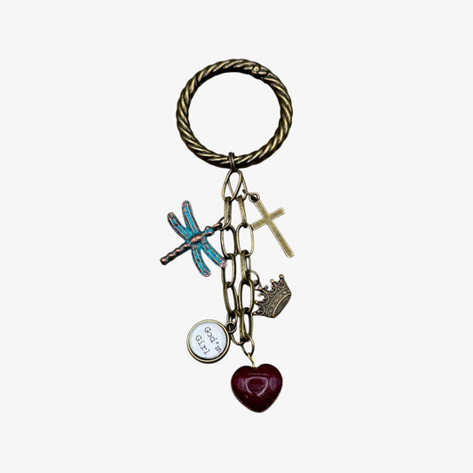 Bag Clip or Boot Clip with various charms on a white background
