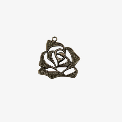 Decorative metal rose pendant on a white background