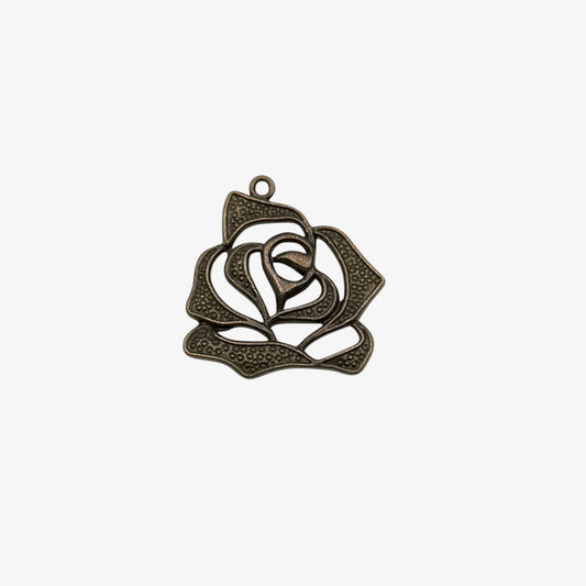 Decorative metal rose pendant on a white background