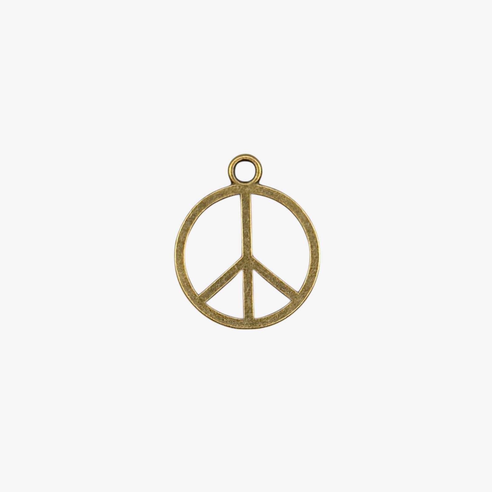 Bronze peace symbol charm on a white background