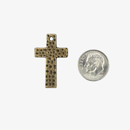 Bronze cross pendant on a white background