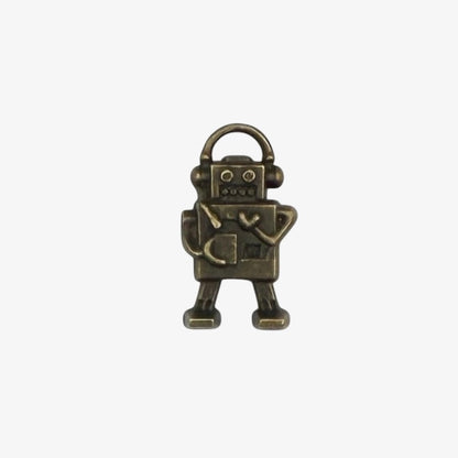 Bronze robot charm on a white background