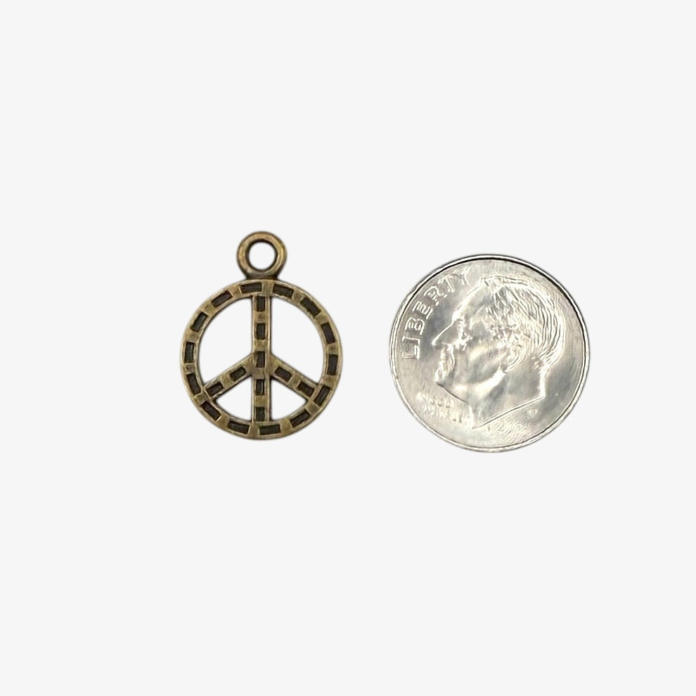 Peace symbol pendant on a white background