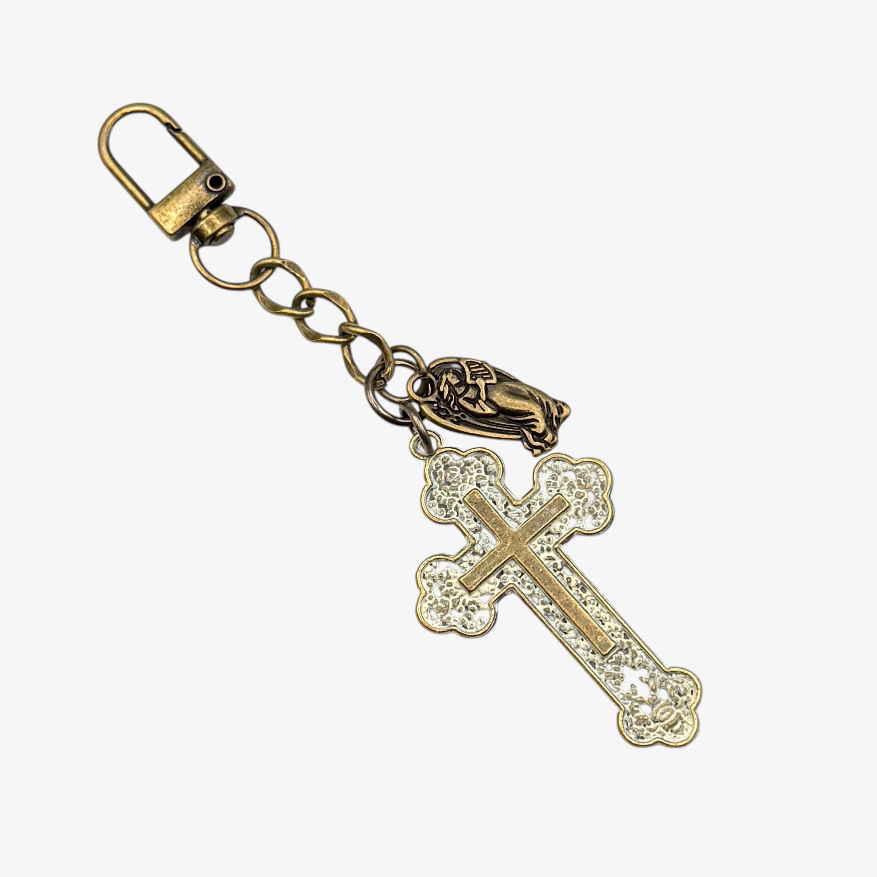 Gold cross keychain with chain on a white background