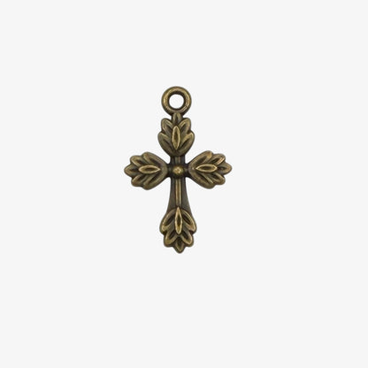 Bronze cross pendant on a white background