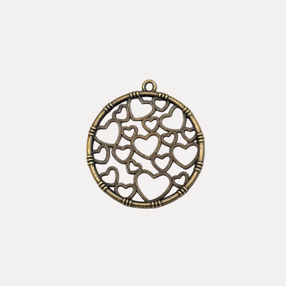 Bronze pendant with heart designs on a white background