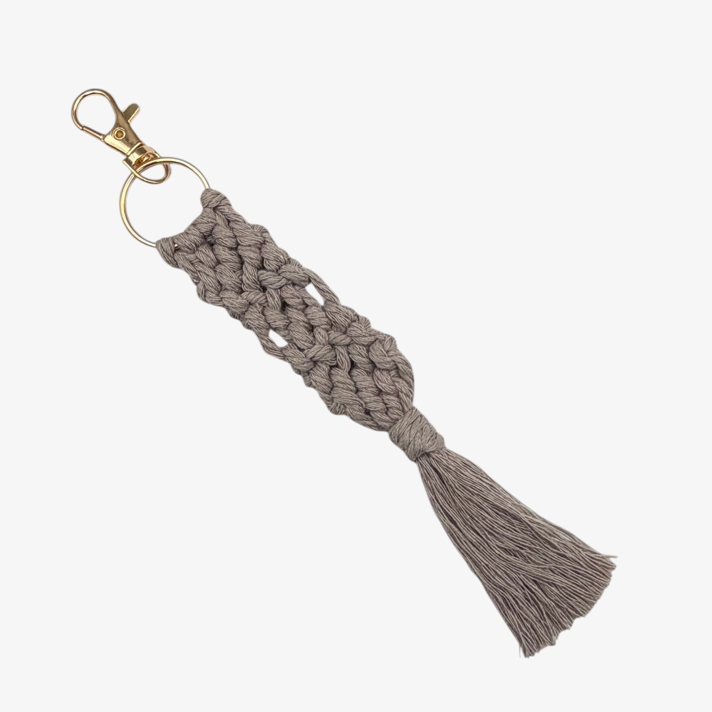 Gray Macrame keychain with tassel on a white background