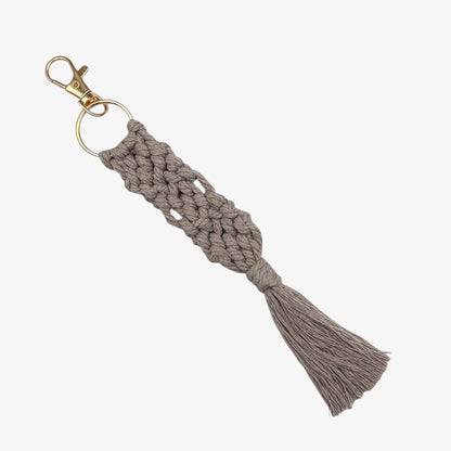Gray Macrame keychain with tassel on a white background