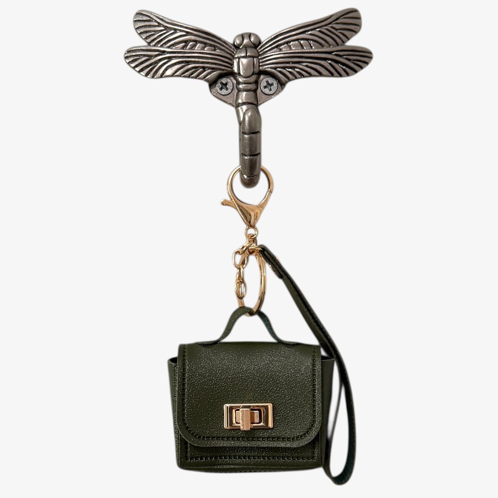 Keychain with a small black handbag and dragonfly design on a white background