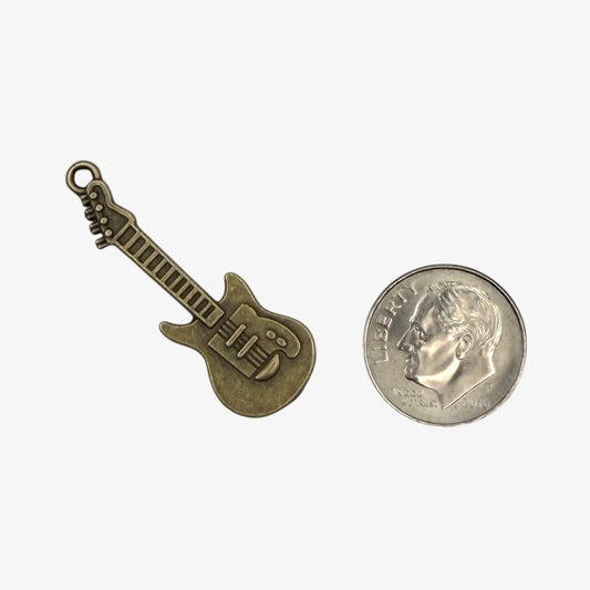 Bronze guitar-shaped pendant on a white background