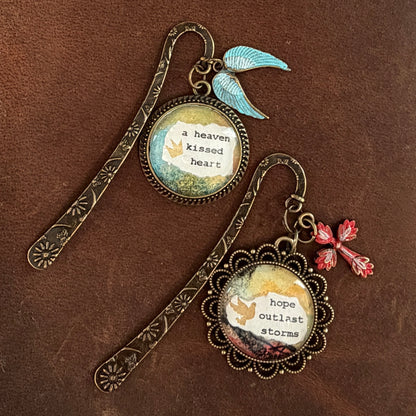 Two decorative bookmarks with inspirational quotes on a brown background