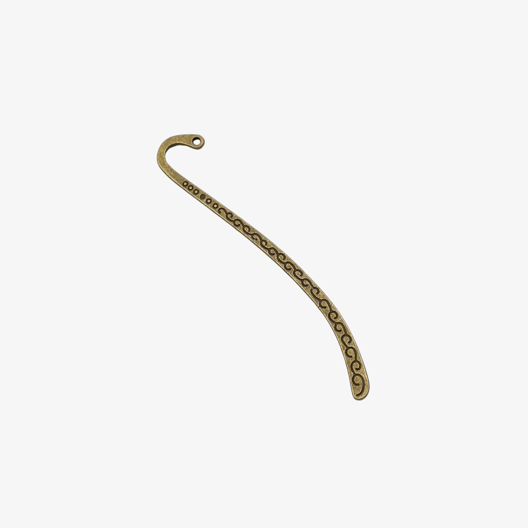 Decorative metal bookmark with a curved design on a white background