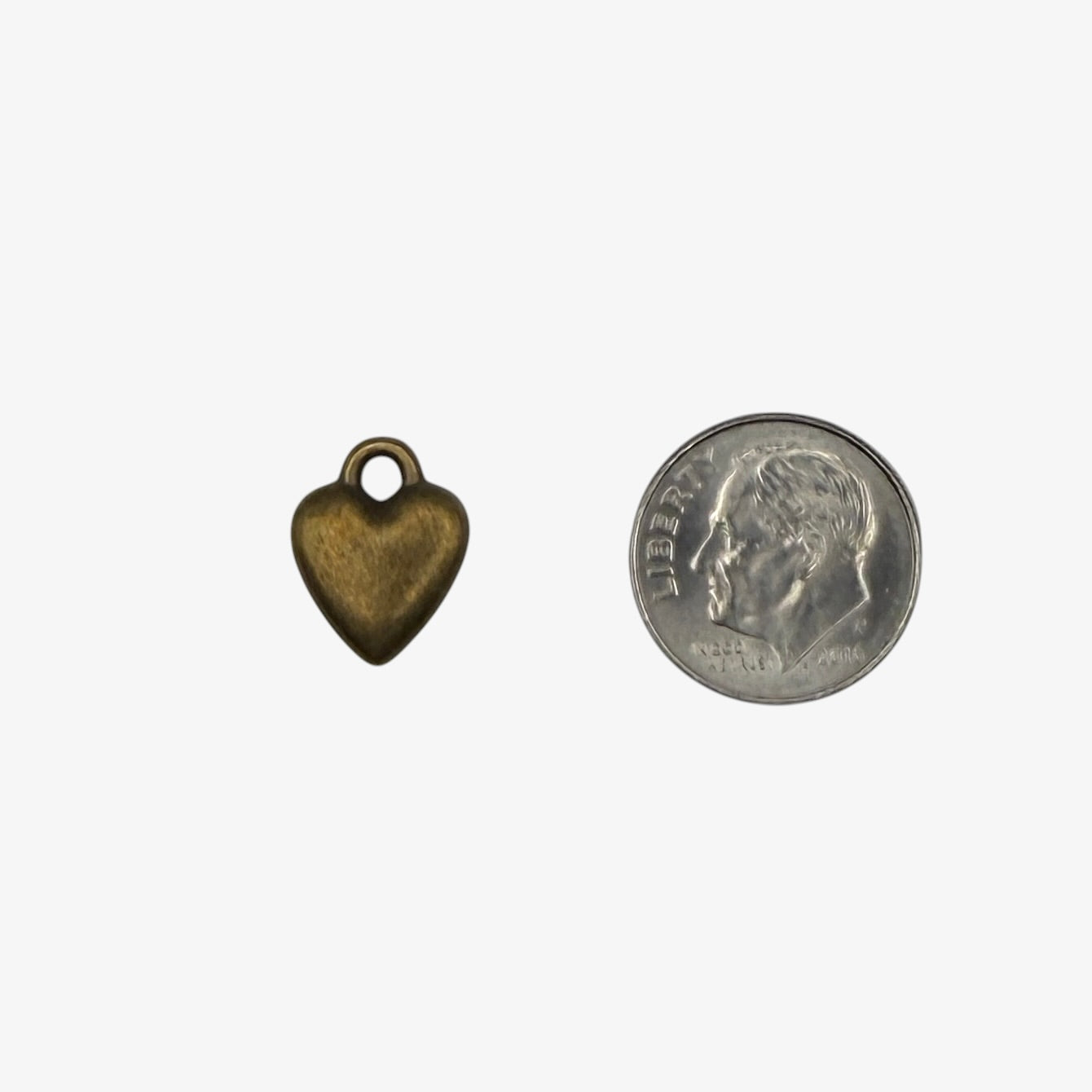 Bronze heart-shaped charm on a white background