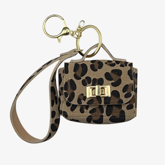 Leopard print handbag with a matching keychain on a white background