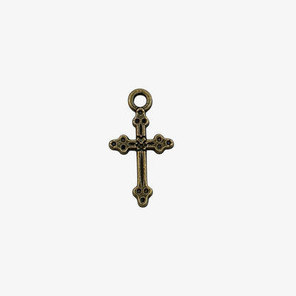 Bronze cross pendant on a white background