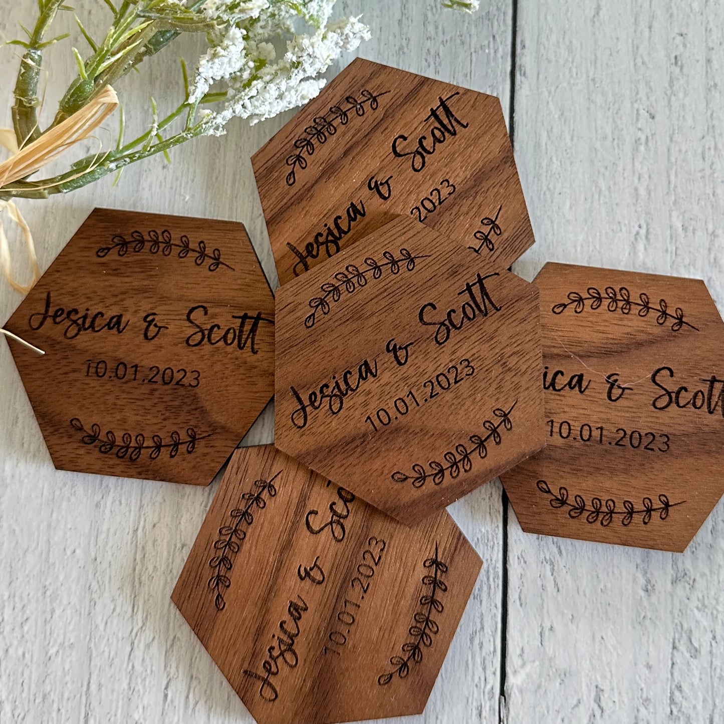 Personalized Wedding Save-the-Date Magnets made from walnut hardwood and laser engraved.