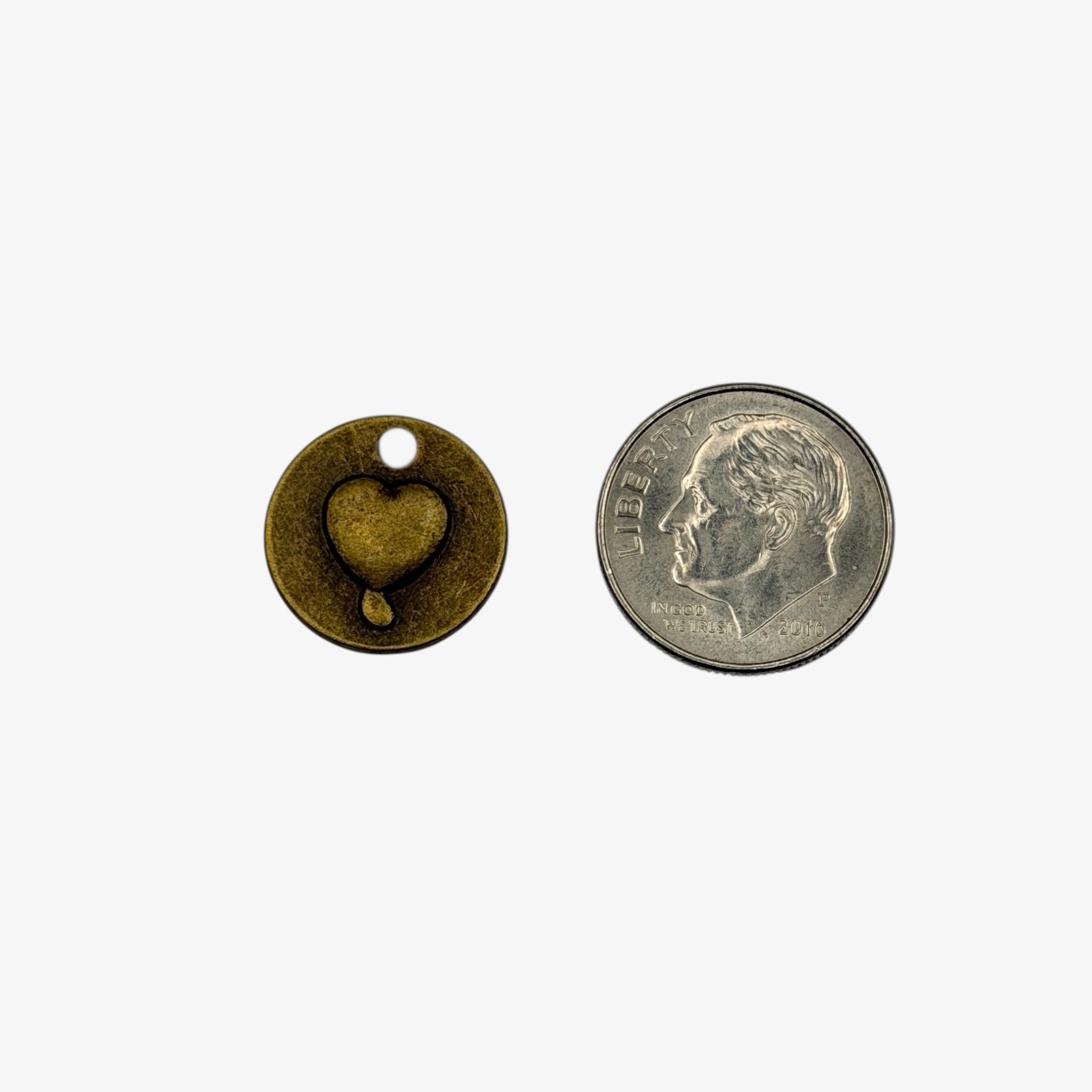 Small bronze round  charm with a heart on one side and love on the other