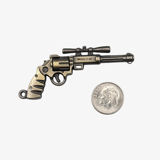Small bronze revolver charm 