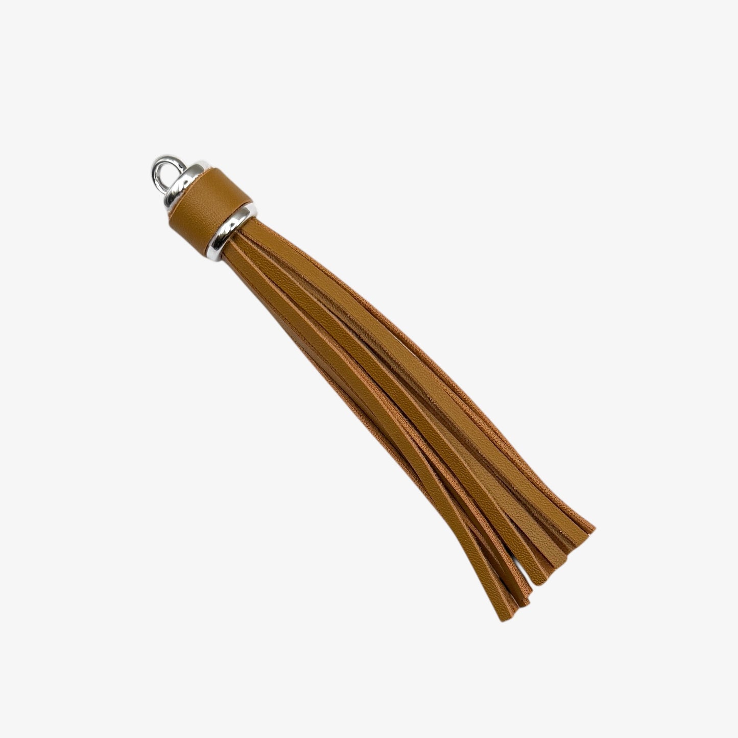 Brown leather tassel with a silver accent on a white background