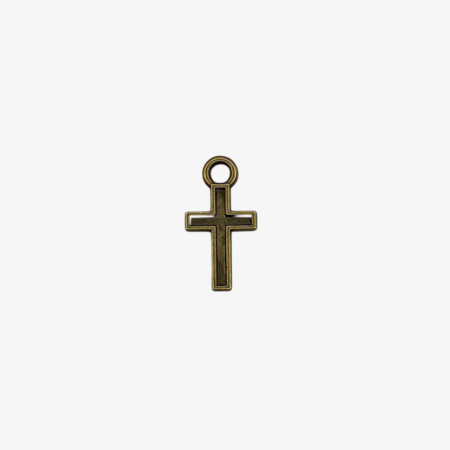 Bronze cross pendant on a white background