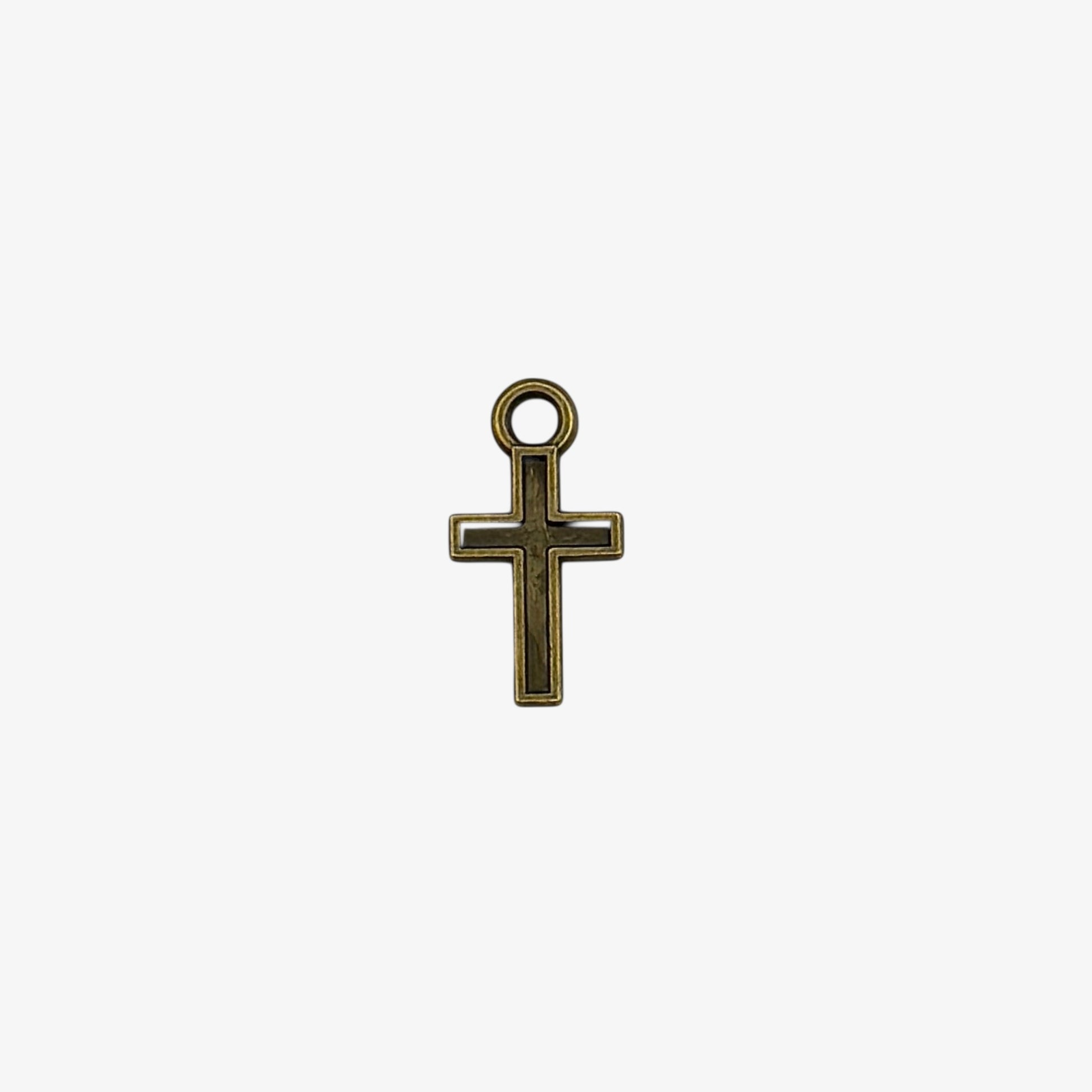 Bronze cross pendant on a white background