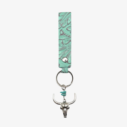 Turquoise leather keychain with bull skull charm on a white background