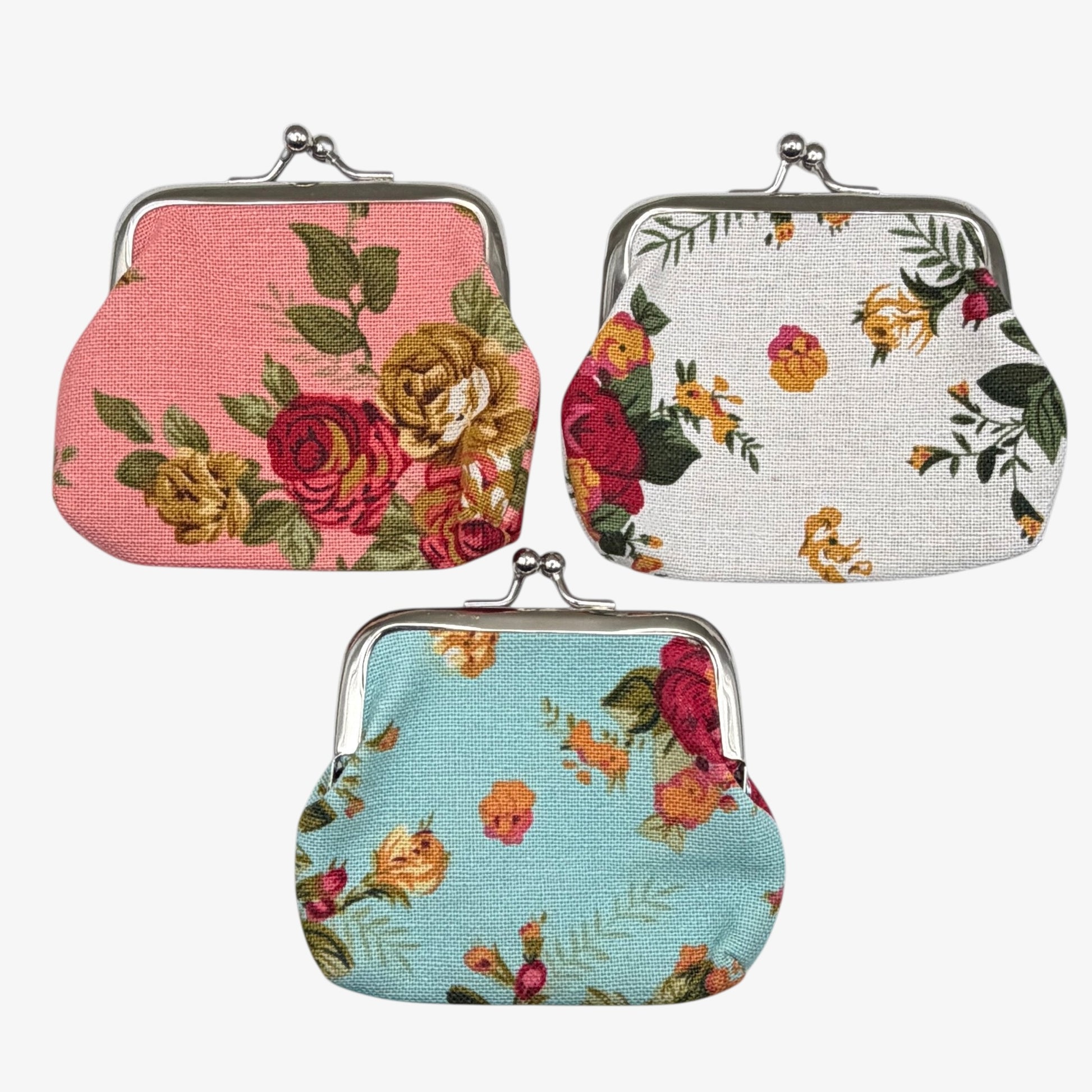 Three floral-patterned coin purses on a white background