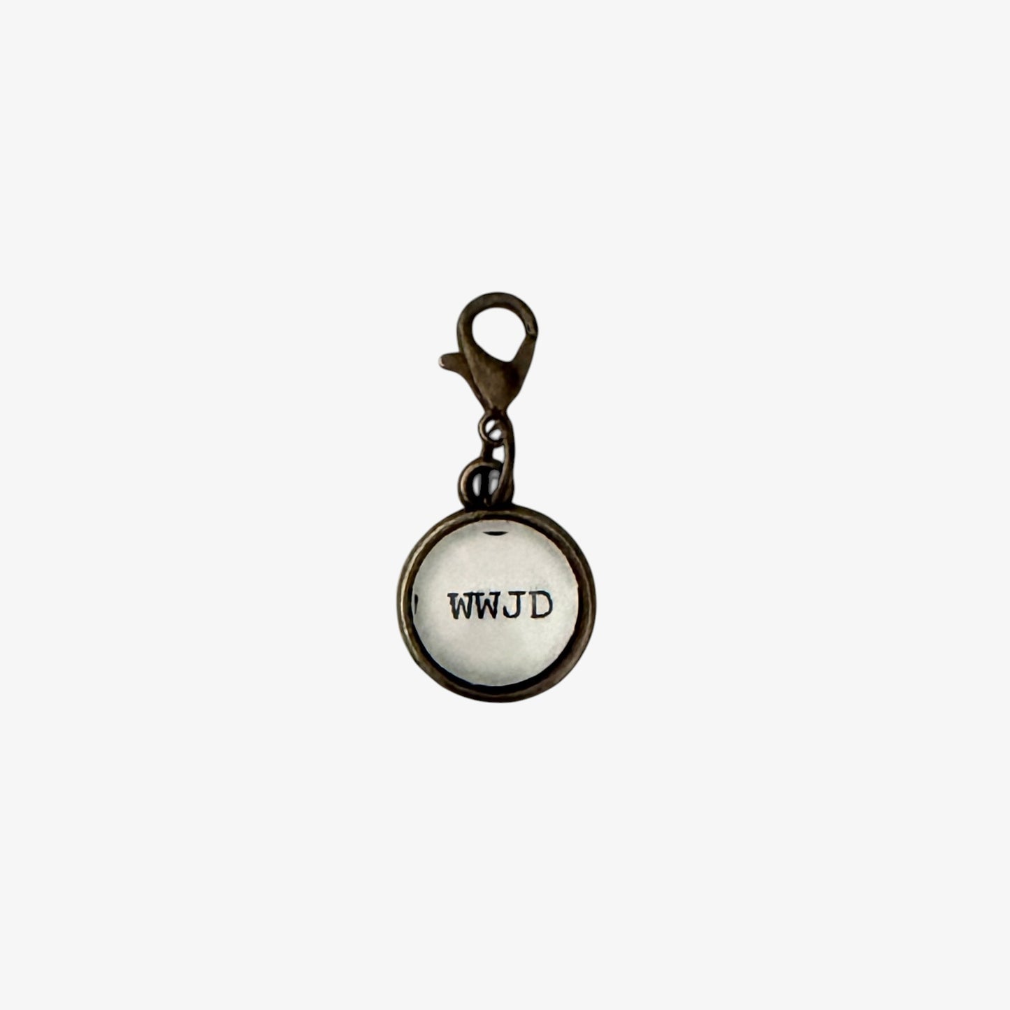 Round charm with 'WWJD' text on a white background
